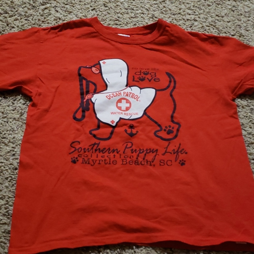Red tee with a dog.